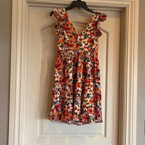 Floral, light and flowy open back dress that ties in the back.